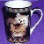 Tasse mit K�tzchen und Fischen